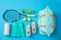 Flat lay composition with sports bag on blue background