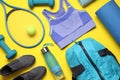 Flat lay composition with sports equipment on yellow background Royalty Free Stock Photo
