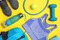 Flat lay composition with sports equipment on yellow background Royalty Free Stock Photo