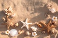 Flat lay composition with starfishes and seashells on sandy beach Royalty Free Stock Photo