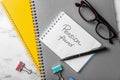 Flat lay composition with stationery, glasses and words PENSION FUND written in notebook on table Royalty Free Stock Photo