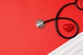 Flat lay composition with stethoscope, heart figure and cardiogram on color background Royalty Free Stock Photo