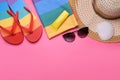 Flat lay composition with sunscreen and beach accessories on pink background. Space for text Royalty Free Stock Photo