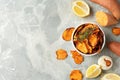 Flat lay composition with sweet potato chips on grey table. Royalty Free Stock Photo