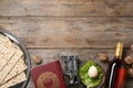 Flat lay composition with symbolic Passover Pesach items on wooden background Royalty Free Stock Photo