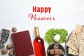 Flat lay composition of symbolic Pesach items on wooden background. Royalty Free Stock Photo