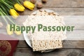 Flat lay composition of symbolic Pesach items on wooden background. Royalty Free Stock Photo