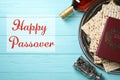 Flat lay composition of symbolic Pesach items on wooden background. Royalty Free Stock Photo