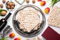 Flat lay composition with symbolic Pesach Passover Seder items on white wooden table Royalty Free Stock Photo