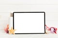 Flat lay composition with tablet and beach accessories on colored background. Tablet computer with blank screen mock up Royalty Free Stock Photo