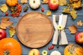 Flat lay composition with tableware, autumn fruits and vegetables on blue wooden background. Thanksgiving Day Royalty Free Stock Photo