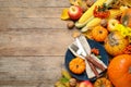 Flat lay composition with tableware, autumn fruits and vegetables on wooden background, space for text. Thanksgiving Day Royalty Free Stock Photo