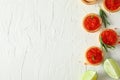 Flat lay composition with tartlets with caviar, rosemary and limes