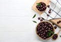 Flat lay composition with tasty acai berries on wooden table. Space for text Royalty Free Stock Photo