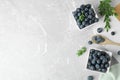 Flat lay composition with tasty blueberries on grey marble table Royalty Free Stock Photo
