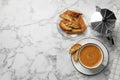 Flat lay composition with tasty cantucci and aromatic coffee on white marble table, space for text. Traditional Italian almond Royalty Free Stock Photo