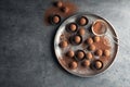 Flat lay composition with tasty chocolate truffles on grey background Royalty Free Stock Photo