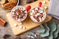 Flat lay composition of tasty cocoa with marshmallows on table Royalty Free Stock Photo