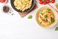 Flat lay composition with tasty pasta on white wooden table, space for text Royalty Free Stock Photo