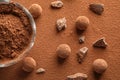 Flat lay composition with raw chocolate truffles on cocoa powder Royalty Free Stock Photo