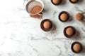 Flat lay composition with tasty raw chocolate truffles on marble background Royalty Free Stock Photo