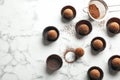 Flat lay composition with tasty raw chocolate truffles on marble background Royalty Free Stock Photo