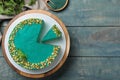 Flat lay composition with tasty spirulina cheesecake on wooden table, space for text Royalty Free Stock Photo