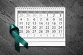 Flat lay composition with teal ribbon and calendar