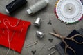 Flat lay composition with thimbles and different sewing tools on grey table Royalty Free Stock Photo