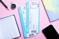 Flat lay composition with tickets on pink background. Travel agency concept