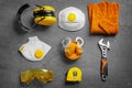 Flat lay composition with tools and safety equipment on grey