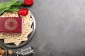 Flat lay composition with traditional Pesach Passover Seder items on grey table. Space for text Royalty Free Stock Photo