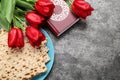 Flat lay composition with traditional Pesach Passover Seder matzo on grey table. Space for text Royalty Free Stock Photo