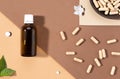 Flat lay composition of various dietary supplements on brown background. Vitamin complexes concept