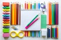Overhead View of Assorted Colorful School and Art Supplies Arranged on a White Background Royalty Free Stock Photo