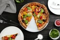 Flat lay composition with vegetable pizza on wooden table Royalty Free Stock Photo