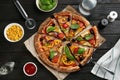 Flat lay composition with vegetable pizza on wooden table Royalty Free Stock Photo