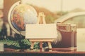 flat lay composition of vintage camera,compass, green plant and word block on wooden table