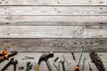 Flat lay composition with vintage carpentry tools on rough wooden background. Top view workbench with carpenter different tools. Royalty Free Stock Photo