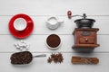 Flat lay composition with vintage manual coffee grinder and spices on white wooden background Royalty Free Stock Photo