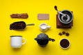 Flat lay composition with vintage manual grinder and geyser coffee maker on yellow background Royalty Free Stock Photo