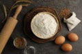 Flat lay composition with wheat flour on dark grey table Royalty Free Stock Photo