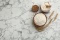 Flat lay composition with wheat flour on white marble table. Space for text Royalty Free Stock Photo