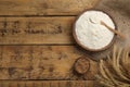 Flat lay composition with wheat flour on wooden table. Space for text Royalty Free Stock Photo