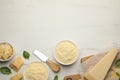 Flat lay composition with whole and grated parmesan cheese on white marble table. Space for text Royalty Free Stock Photo
