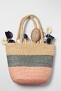Flat lay composition with wicker bag and other beach accessories on white background Royalty Free Stock Photo