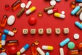 Flat lay composition with word Doping and drugs on red background