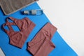 Flat lay composition with yoga equipment on grey background