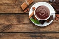Flat lay composition with yummy hot chocolate on wooden table, space for text Royalty Free Stock Photo