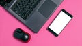 Flat lay, computer mouse, smartphone and laptop on a pink background, copy space. Mock up on the smartphone screen Royalty Free Stock Photo